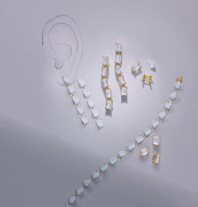Luxurious layout of Motek Jewelry radiant and emerald-cut diamond tennis bracelets and matching drop earrings on himish.com.