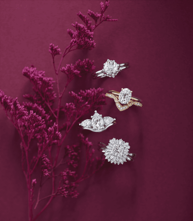 Motek Jewelry diamond engagement rings including halo, cluster, and pear cuts with floral accents.