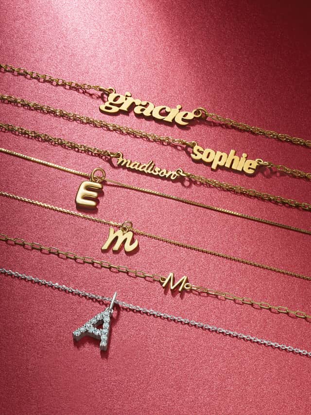 Motek Jewelry custom nameplate necklaces and initial letter pendant chains in 14k yellow gold.