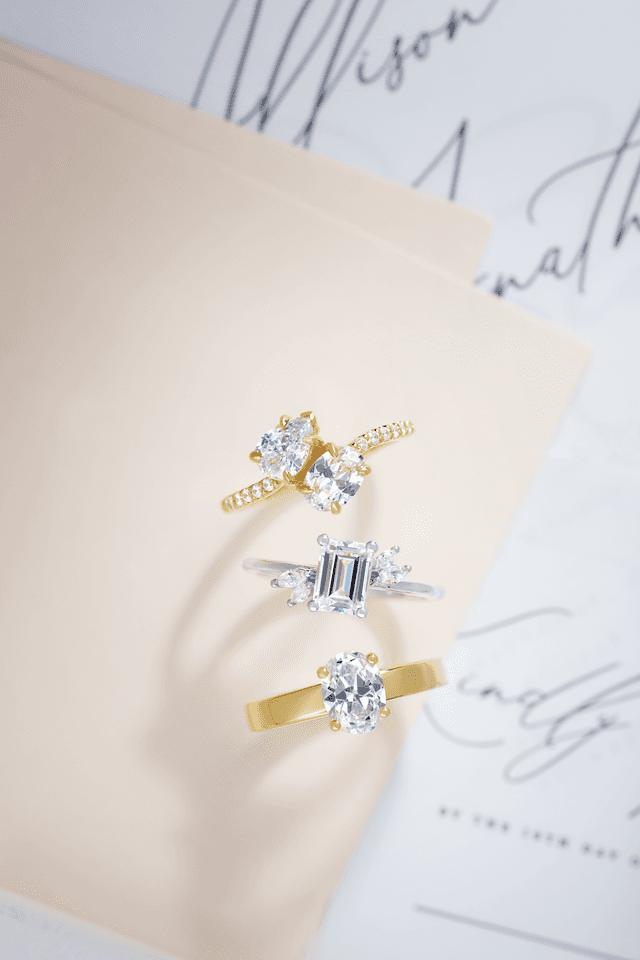 Motek Jewelry Toi et Moi two-stone diamond ring in yellow gold and emerald-cut diamond ring in platinum.
